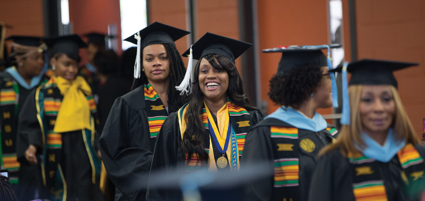Wayne State University graduates receiving their diplomas