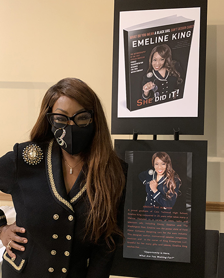 Emeline King with posters of her book