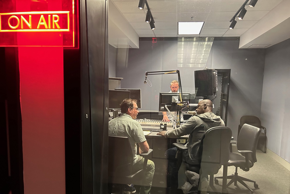 3 people in a radio studio